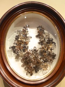 Hair wreaths were popular memorials from 1850-1880. This wreath was created from the hair of the Sherman sisters, Emily (12), Amelia (7) and Helen (5) who all passed away from diphtheria in 1879. Hair Wreath: Petaluma Museum, Petaluma, CA (Photo: ©Skyfeather Studio)
